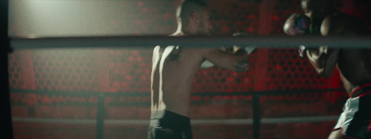 Two men train in a boxing ring