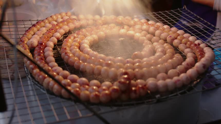 The food is cooking on the grill