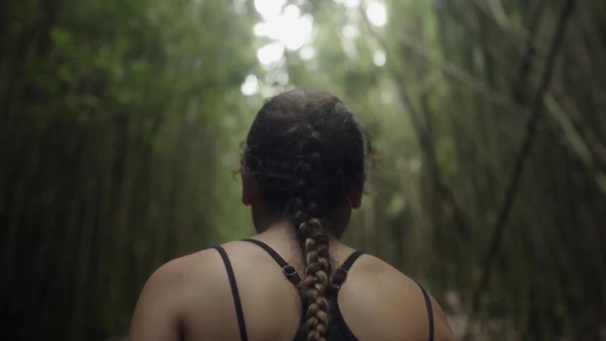 Woman hiking in a bamboo forest