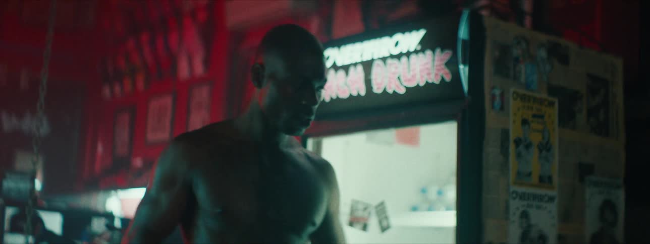 A man takes a drink from a water bottle