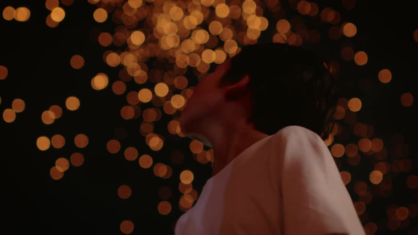 A boy looks up at the shining lights in the sky