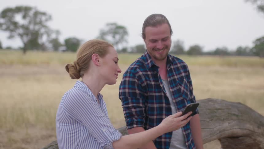 A man and woman laugh together
