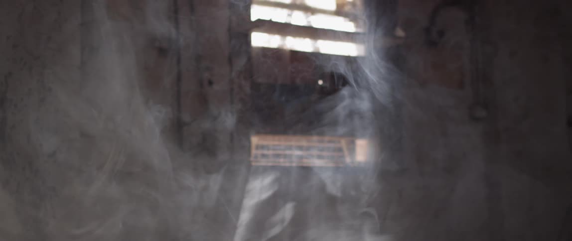 Smoke floats around inside the building