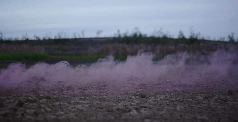 Purple smoke carries in the breeze