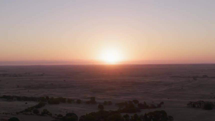 View of sunset over a field