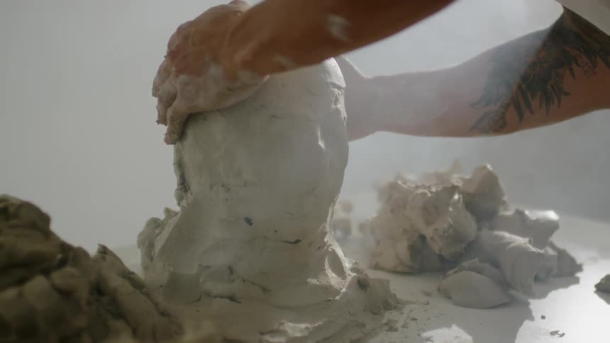A man creates a sculpture