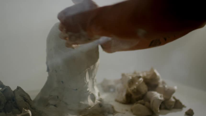 A man creates a sculpture