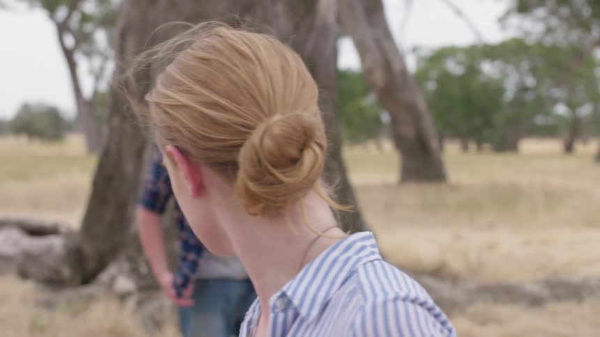 A man and woman argue outside
