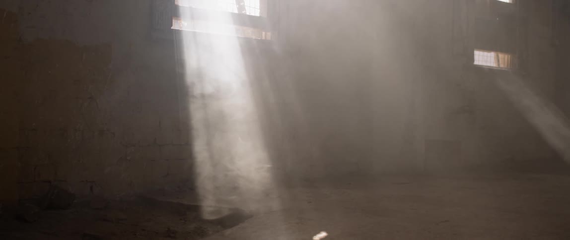 Sunlight filters through small windows