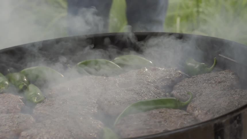 Hamburgers being cooked on a grill