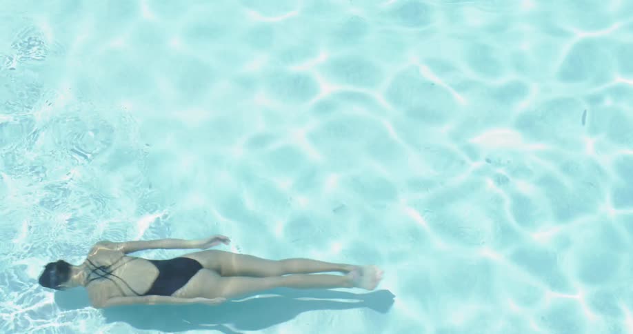 Woman Swimming In Pool