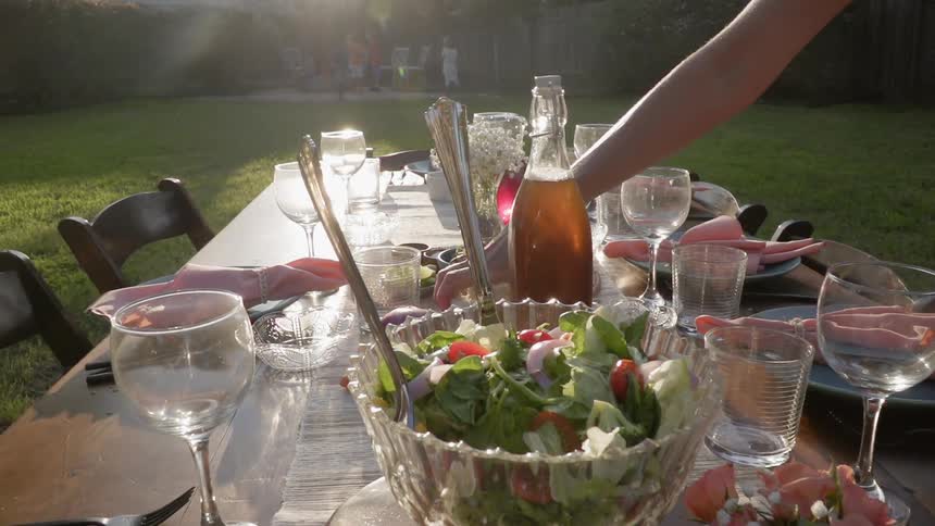 Food and drink is served at an outdoor table