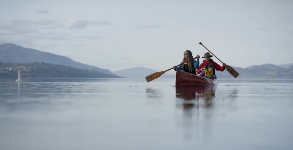 A man and woman row a boat