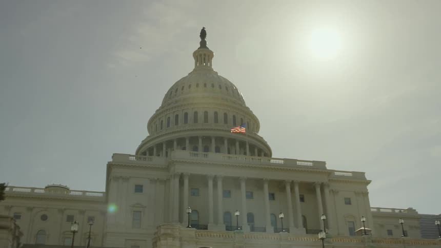 Sunlight shines on a capitol building