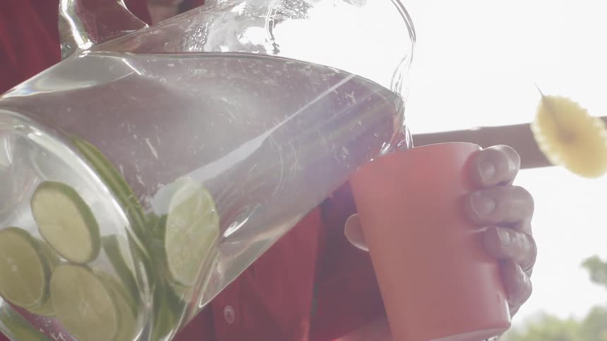 A drink is poured from a pitcher