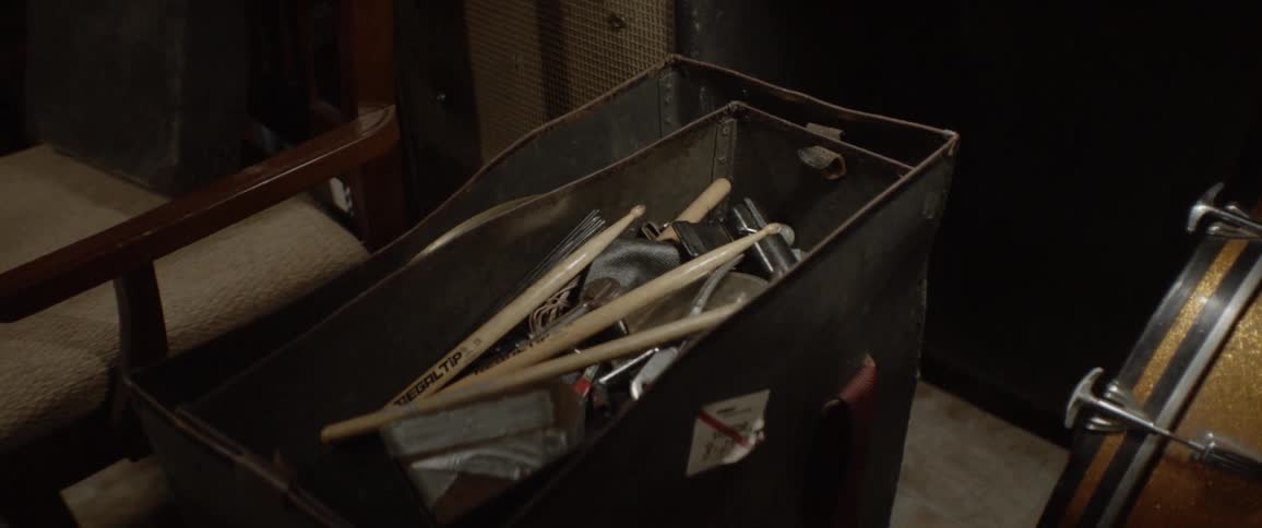 Drumsticks in a large bin