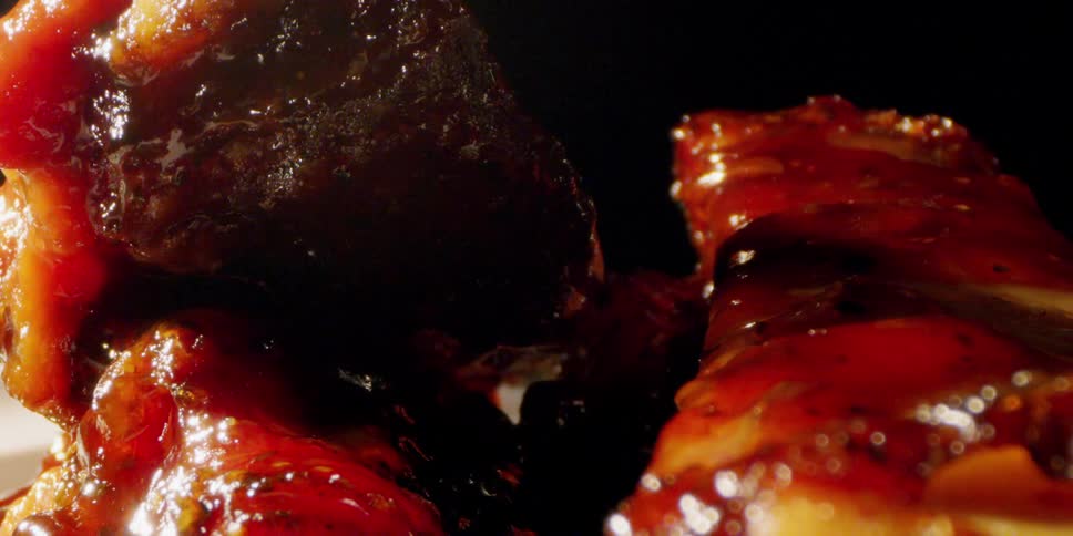 Meat with sauce being poured over it