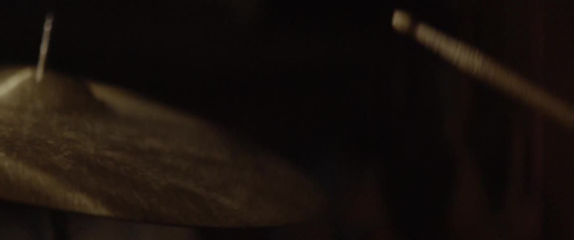 Drumsticks hit a cymbal