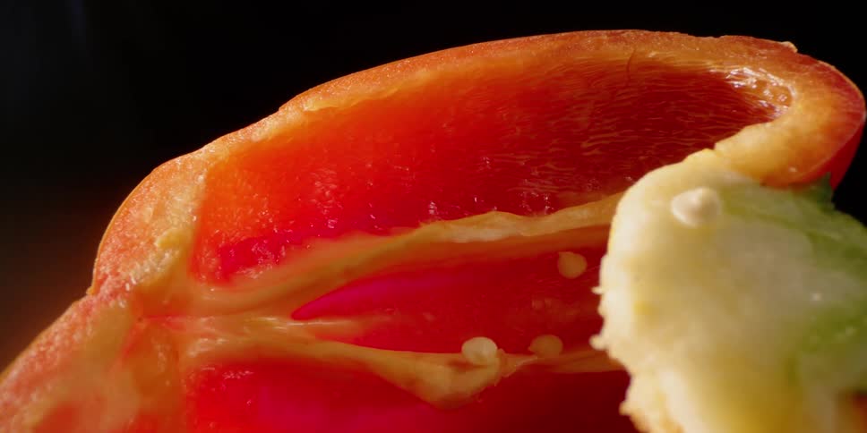 Inside of a red bell pepper that is cut in half