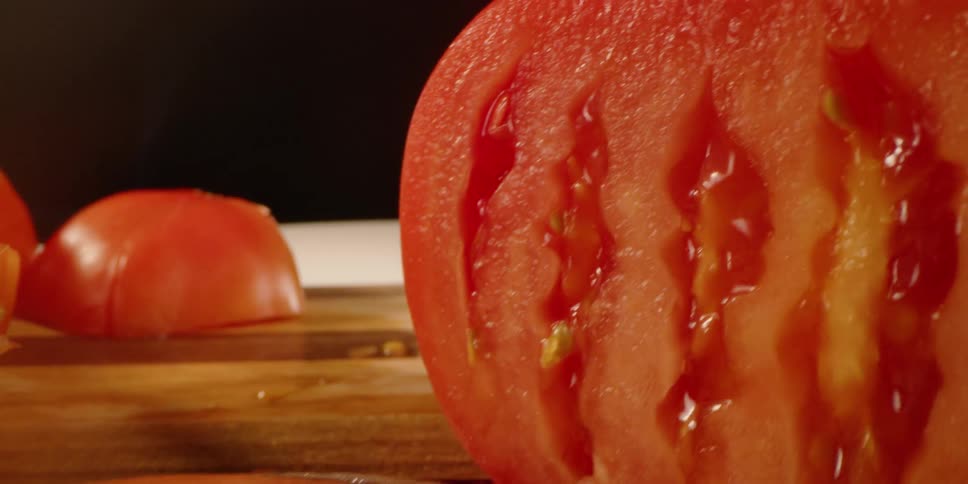 Slices of tomatoes on a cutting board