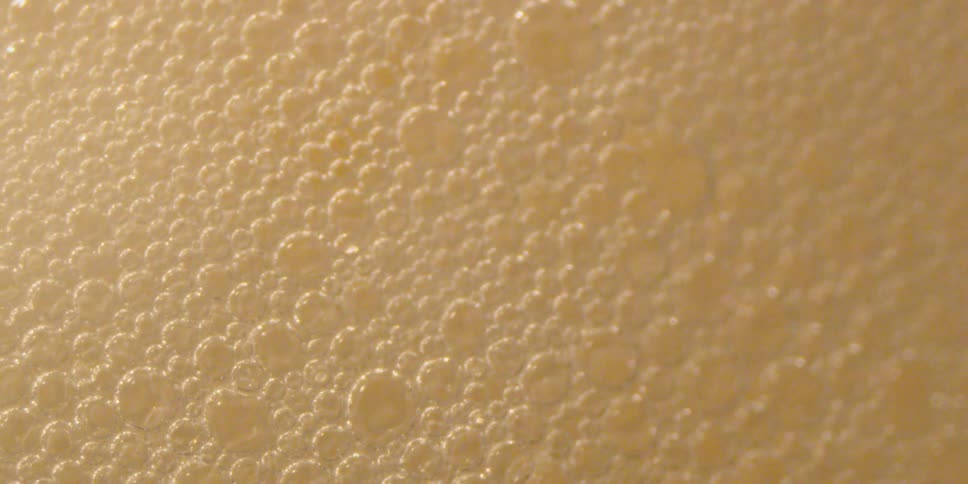 The bubbles in the drink slowly pop