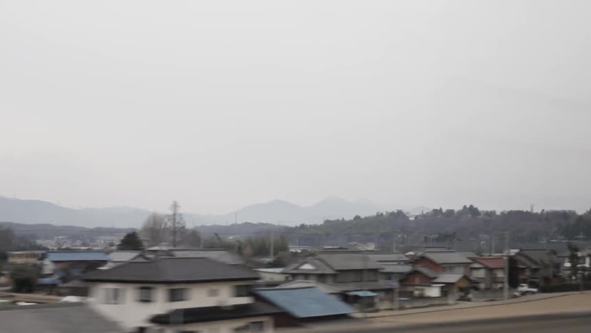 Traveling on a road overlooking homes in a neighborhood