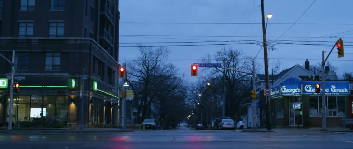 The light turns red on the street at sunset