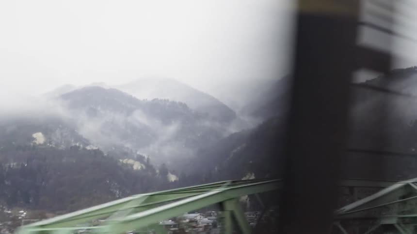 Mist floats up around the mountains