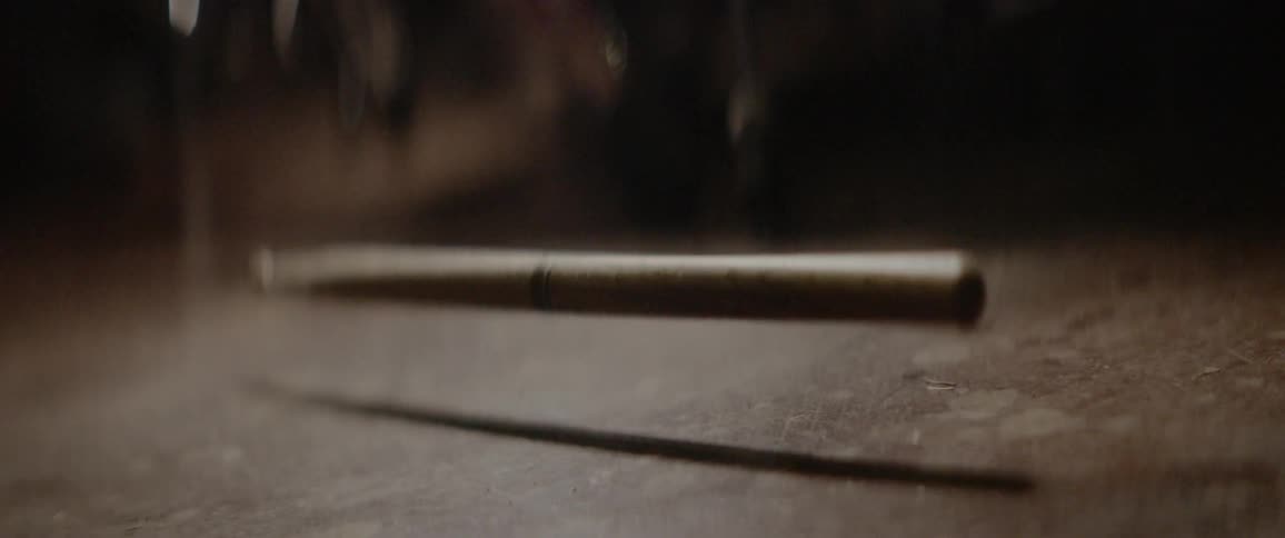 Drumstick falling on the floor and bouncing until it settles