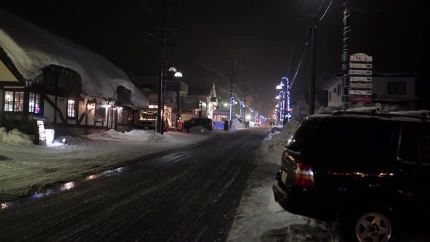 Street lights shine in a small quaint village