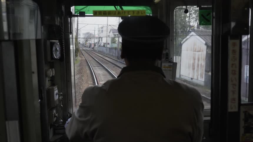 Man is driving train through town