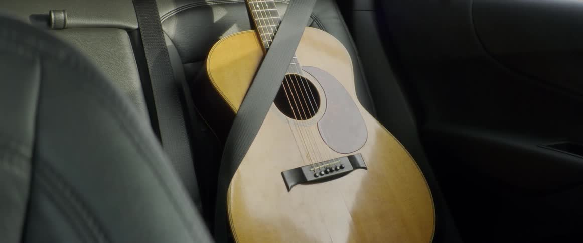 Man Refurbishing Guitar