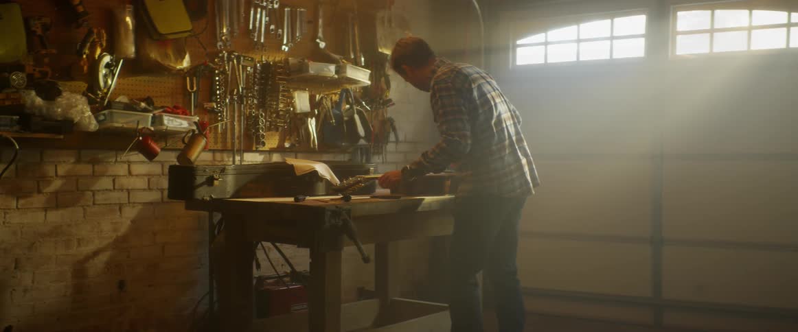 A man is working in his garage