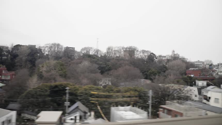Traveling on a road overlooking homes and apartment buildings