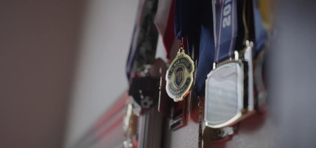 The medals are hanging on the wall