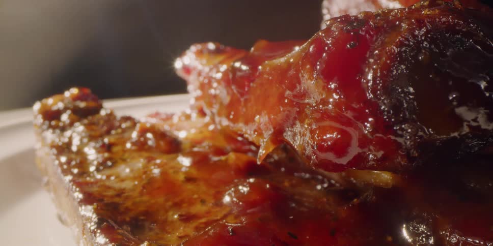 Pile of sauced meat on a plate