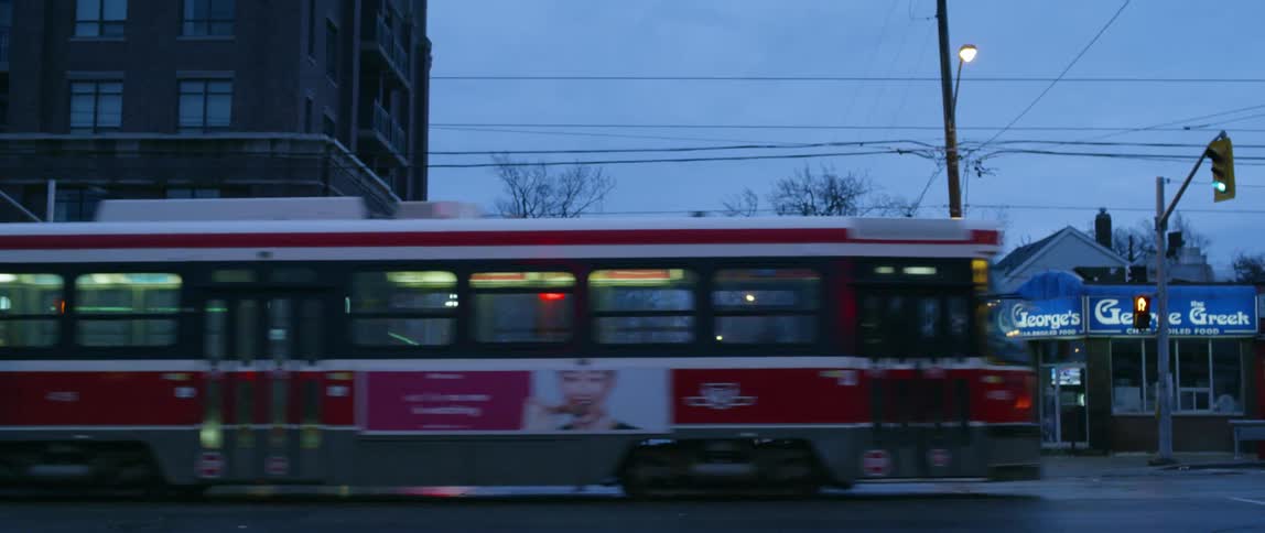 Cars travel on the street at sunset