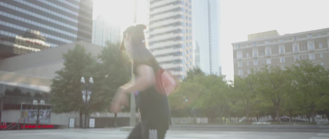 A person is breakdancing in the city