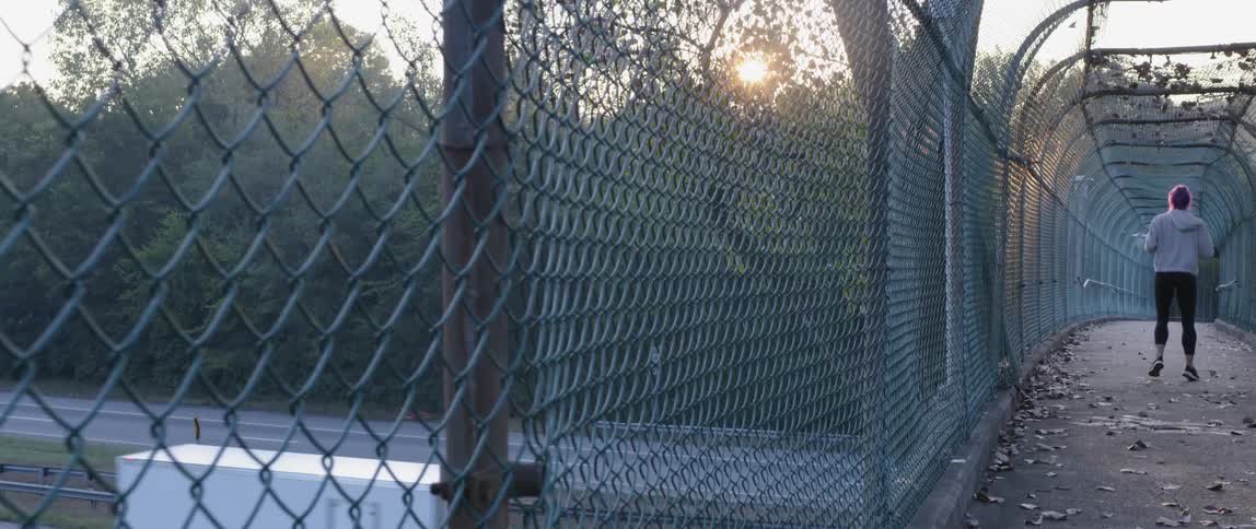 Behind the fence is a highway below