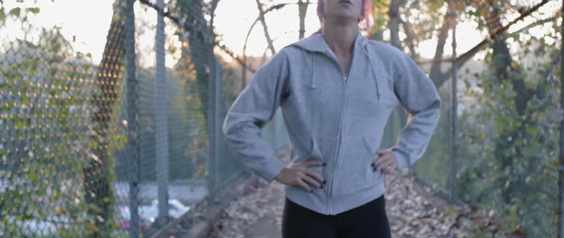 Woman catches breath after jogging