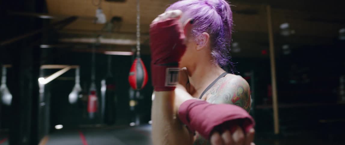 Woman warms up in boxing gym