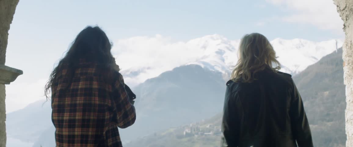 Two women stop to enjoy the view in mountains