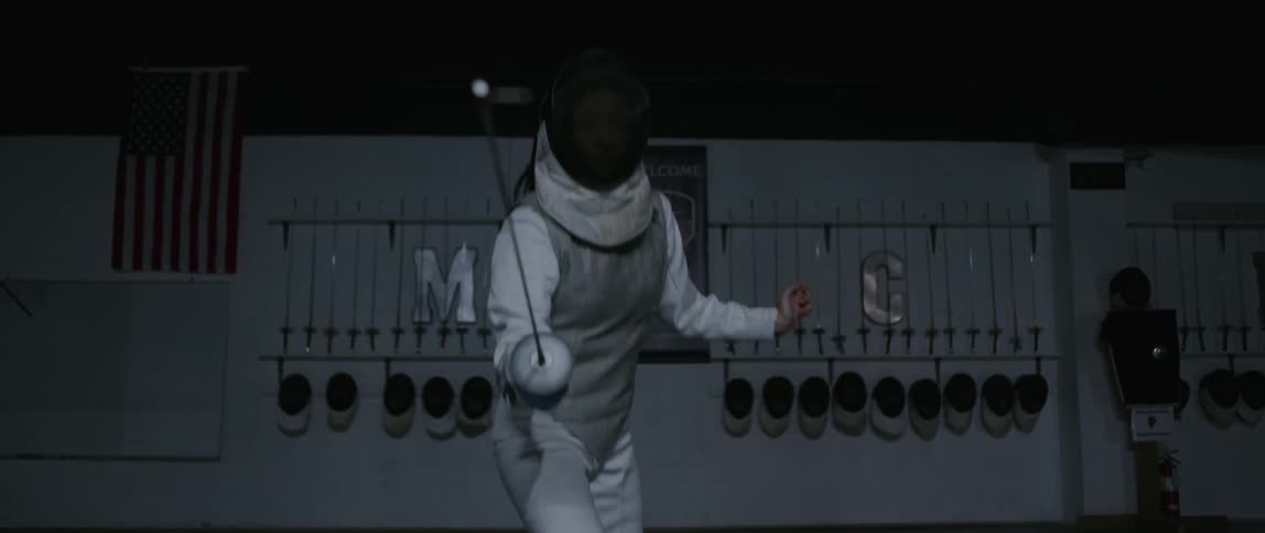 Person is fencing in mask and suit