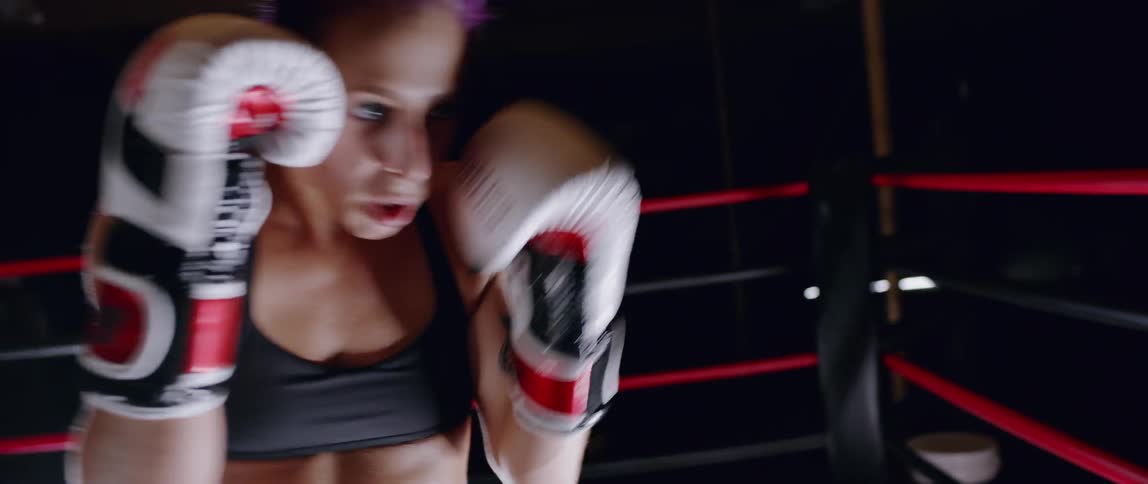 A woman is punching in the ring