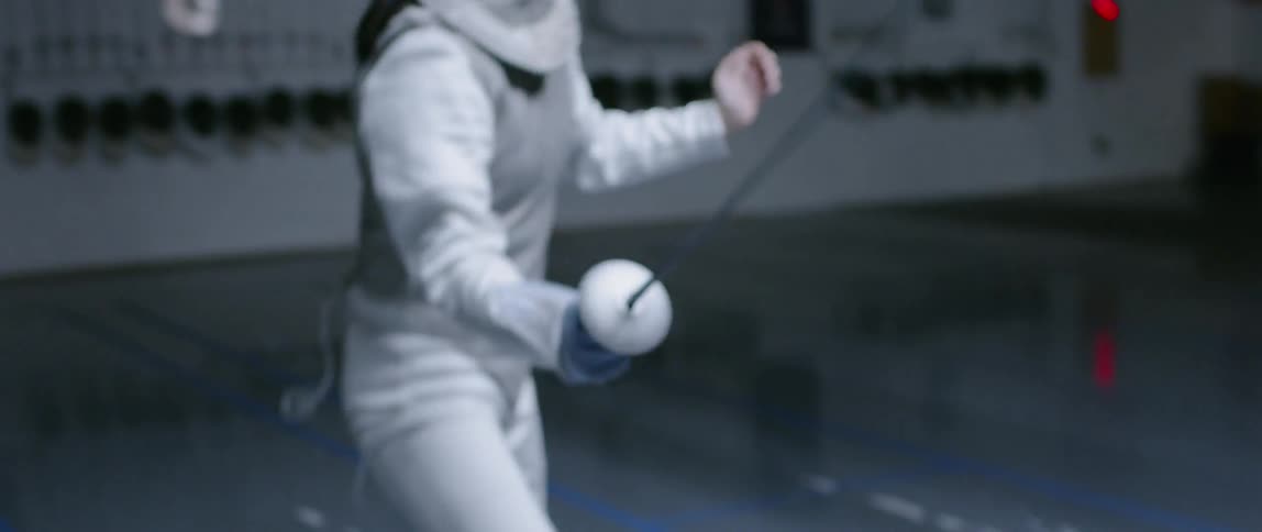 The woman drives forward fencing