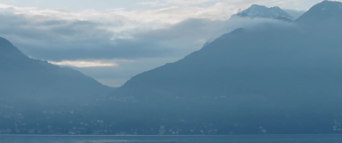 The mountains ahead are covered in fog
