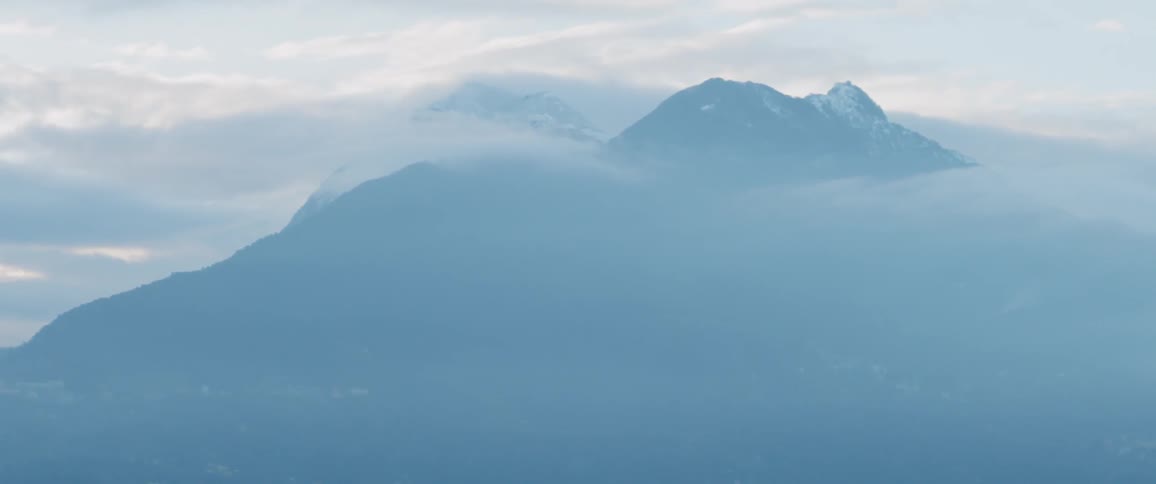 View of mountains through the clouds