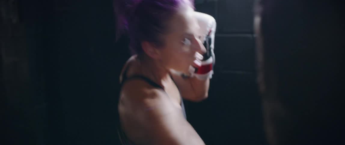 Woman practicing boxing in a gym