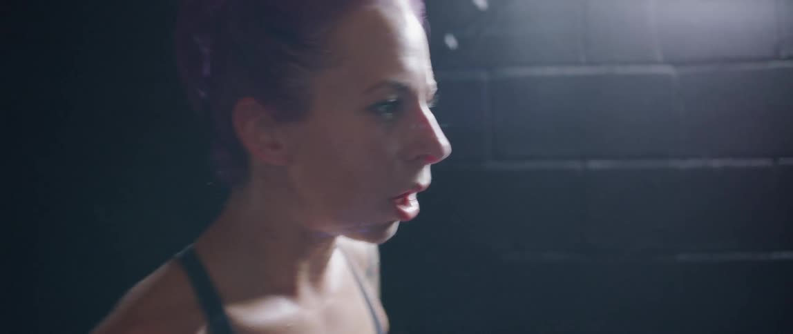 Woman practicing boxing in a gym
