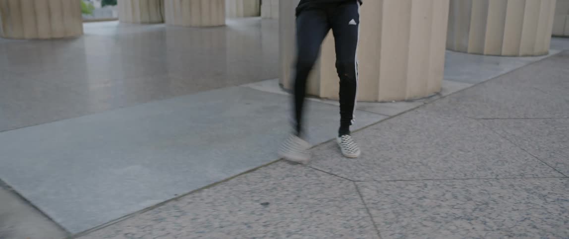 Man Dancing Around The City